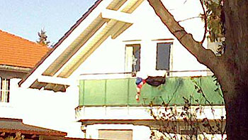 Deflated snowman on a balcony. (novala) Deflated snowman on a balcony. (novala)